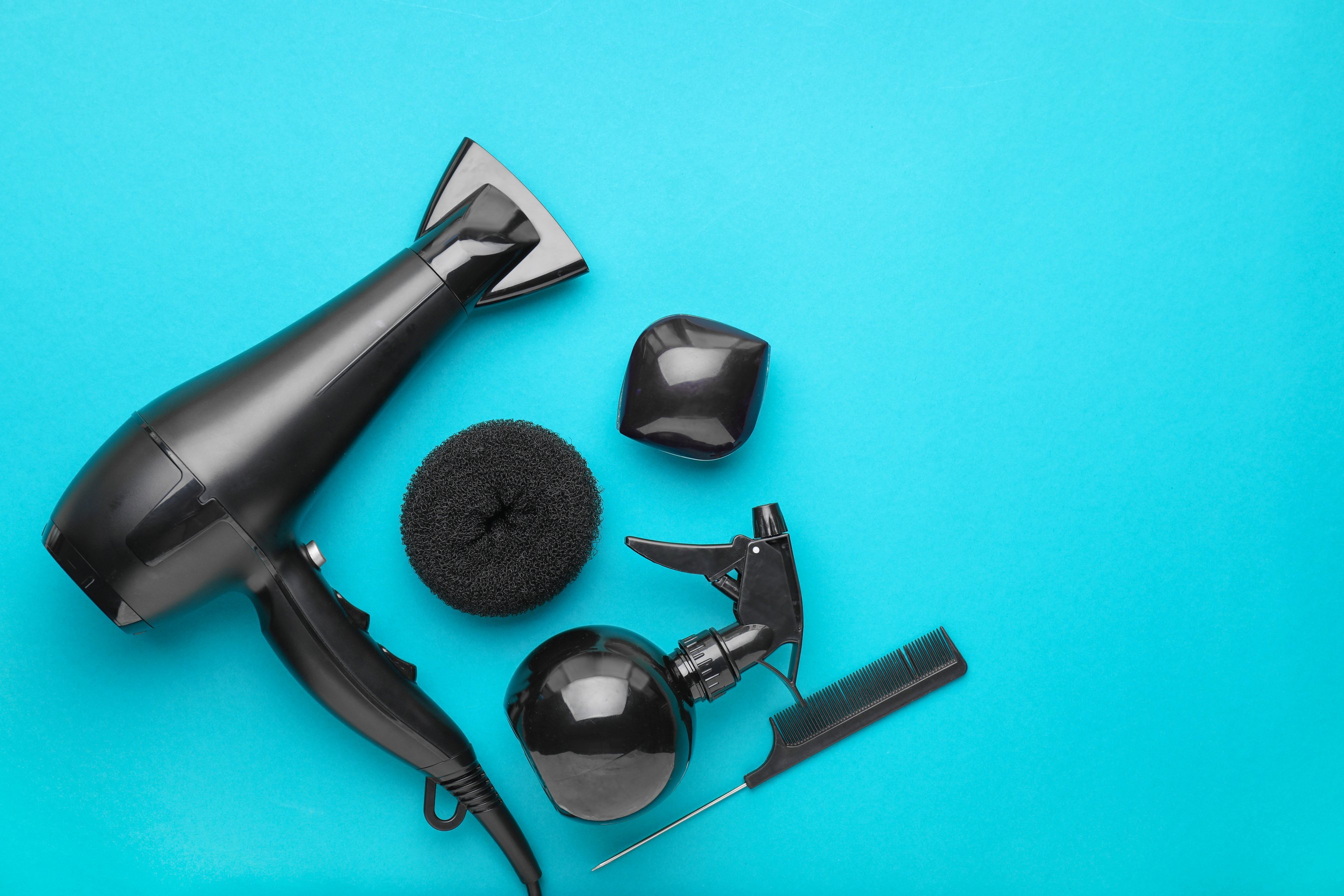 Modern Blow Dryer and Hairdresser Tools on Color Background